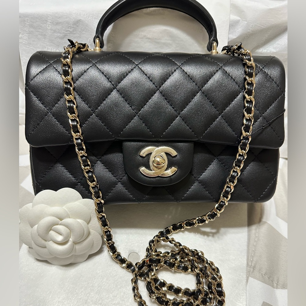 SOLD🎉🎉Authentic Chanel Mini Top Handle in lambskin and gold hardware.